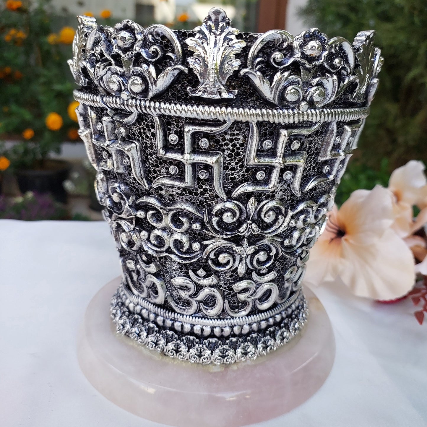 Silver Swastik Vase on Rose Quartz